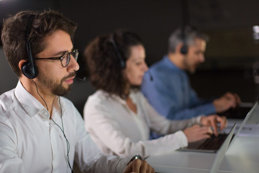 concentrated bearded call center operator working 1