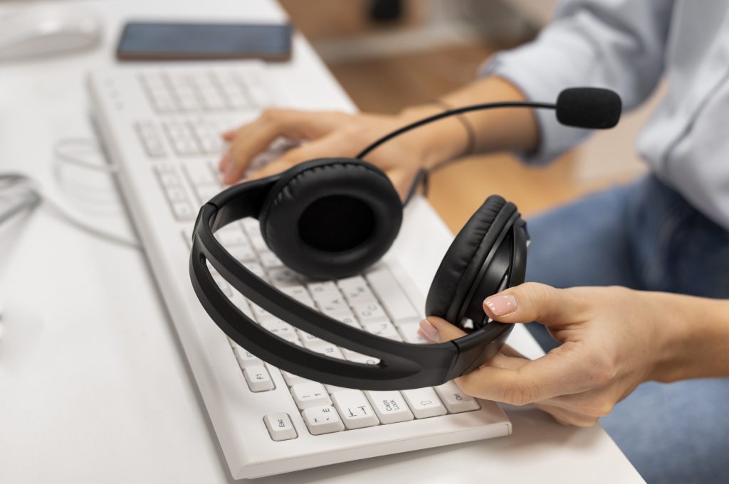 woman working call center holding pair headphones 1