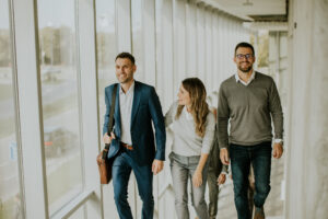 group corporate business professionals climbing stairs office corridor